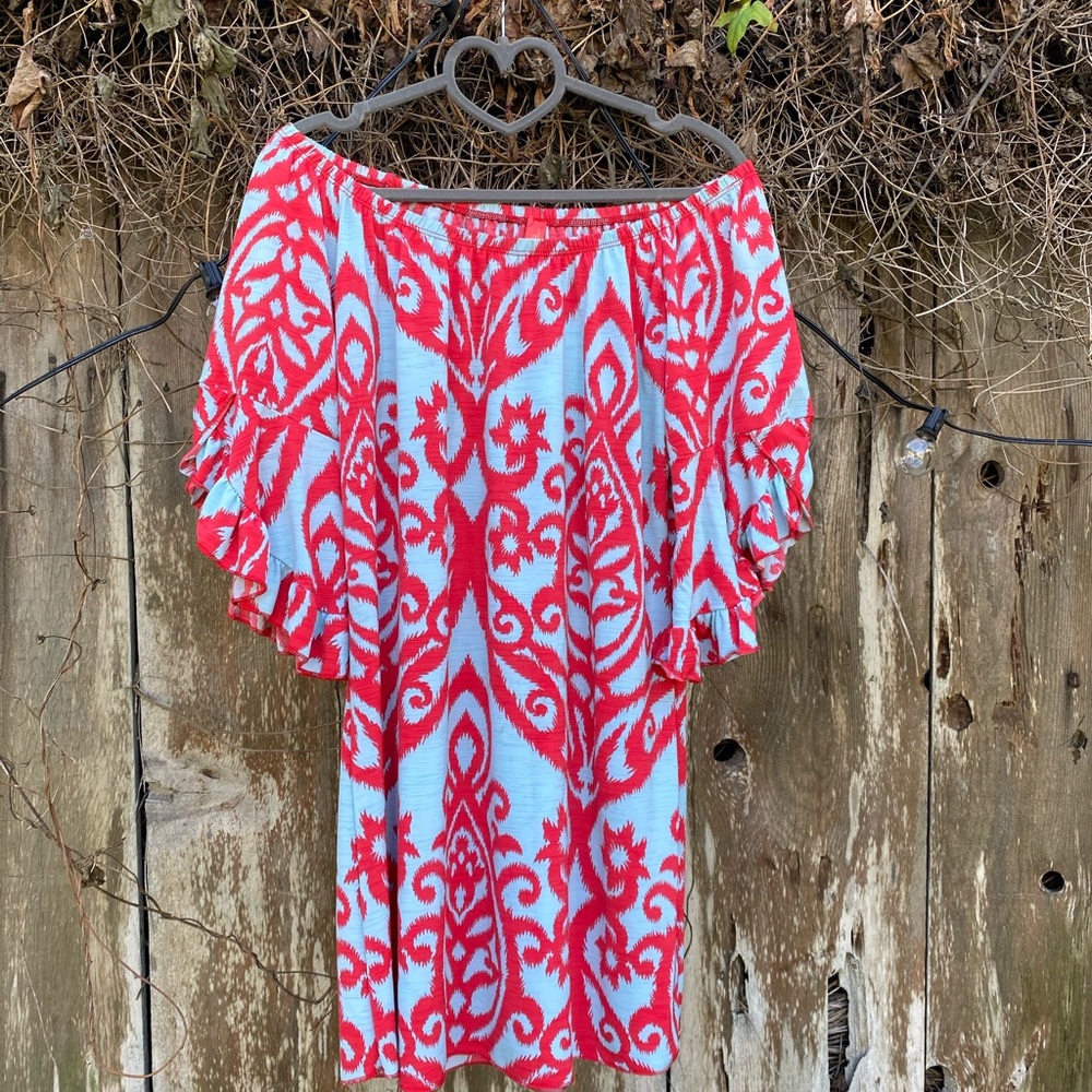 Cute off the shoulder dress with flowy sleeves.